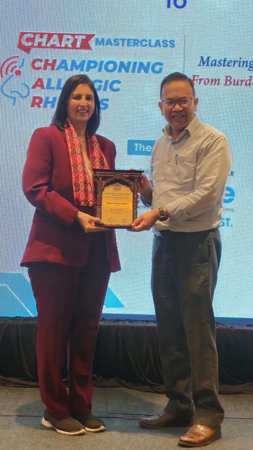Dr. Sunita Chhapola Shukla receiving a token of appreciation from the Nepal ENT Society